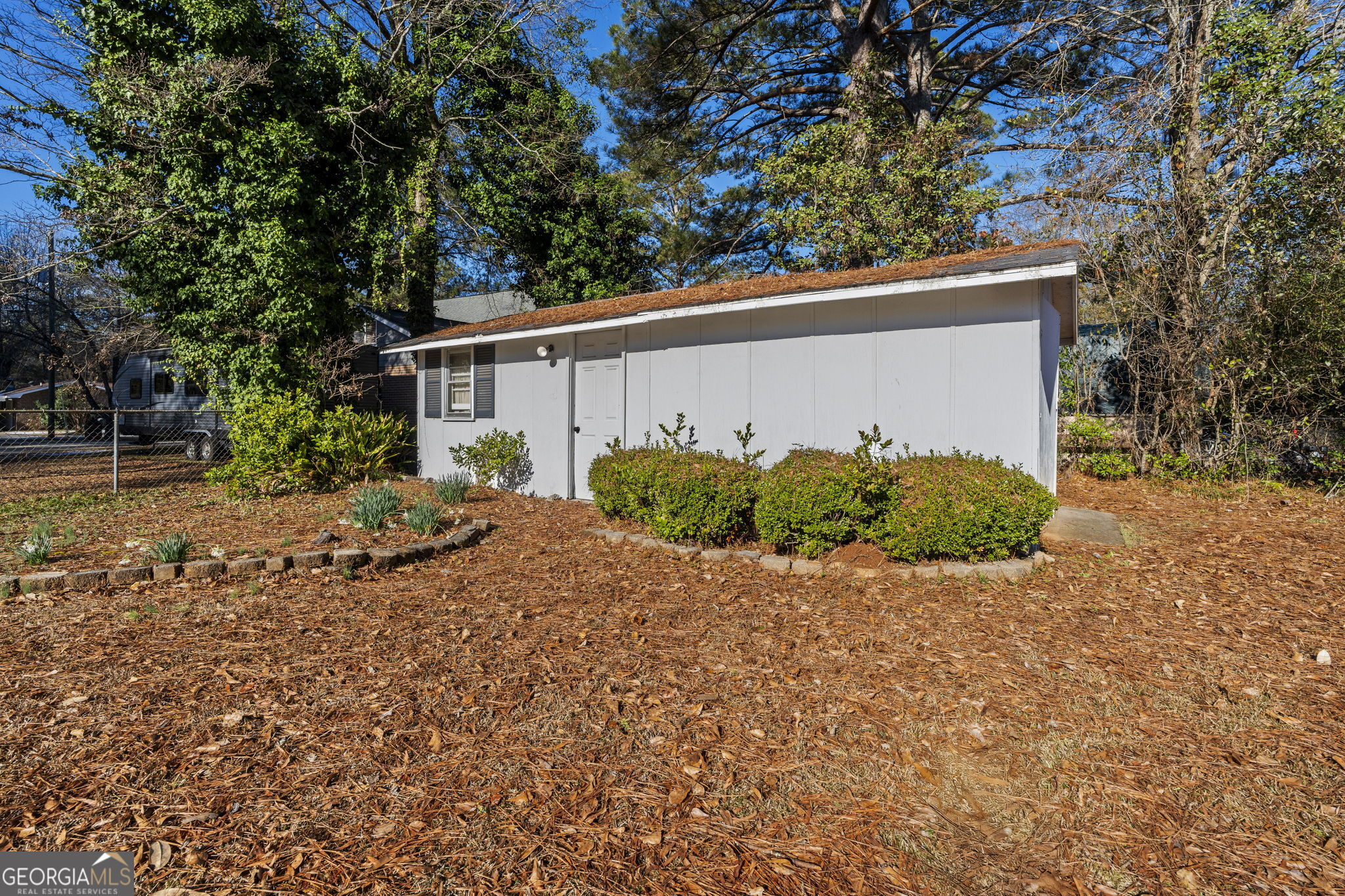1729 Milton Way Perry, GA 31069 - Photo 41 of 41 a backyard of a house with plants and trees