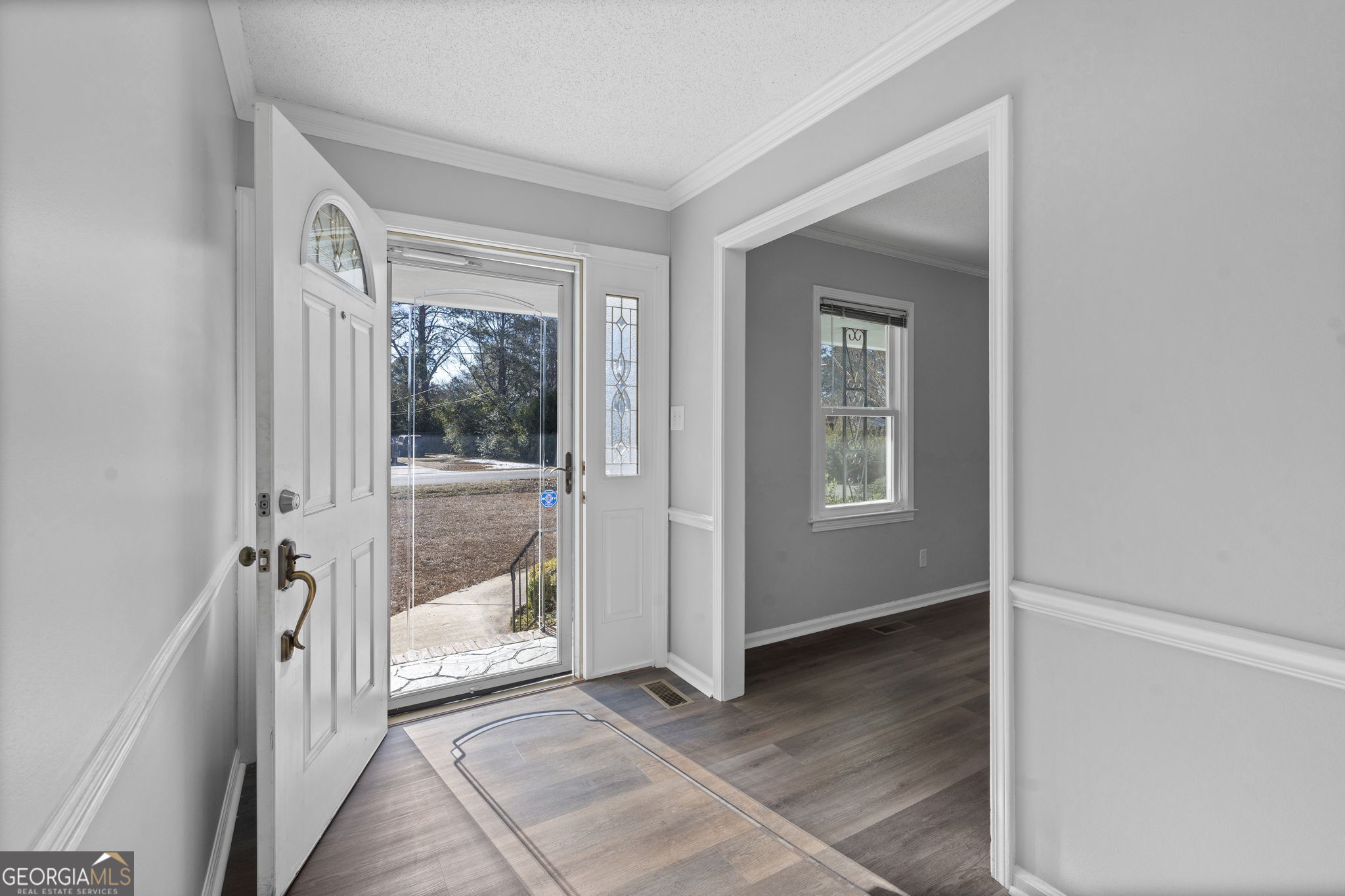 1729 Milton Way Perry, GA 31069 - Photo 6 of 41 a view of a hallway with a glass door and a window