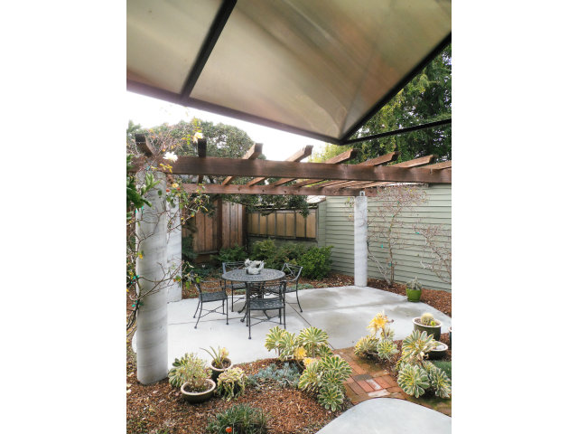 209 Channing Road Burlingame, CA 94010 - Photo 17 of 25 a swimming pool with outdoor seating and yard