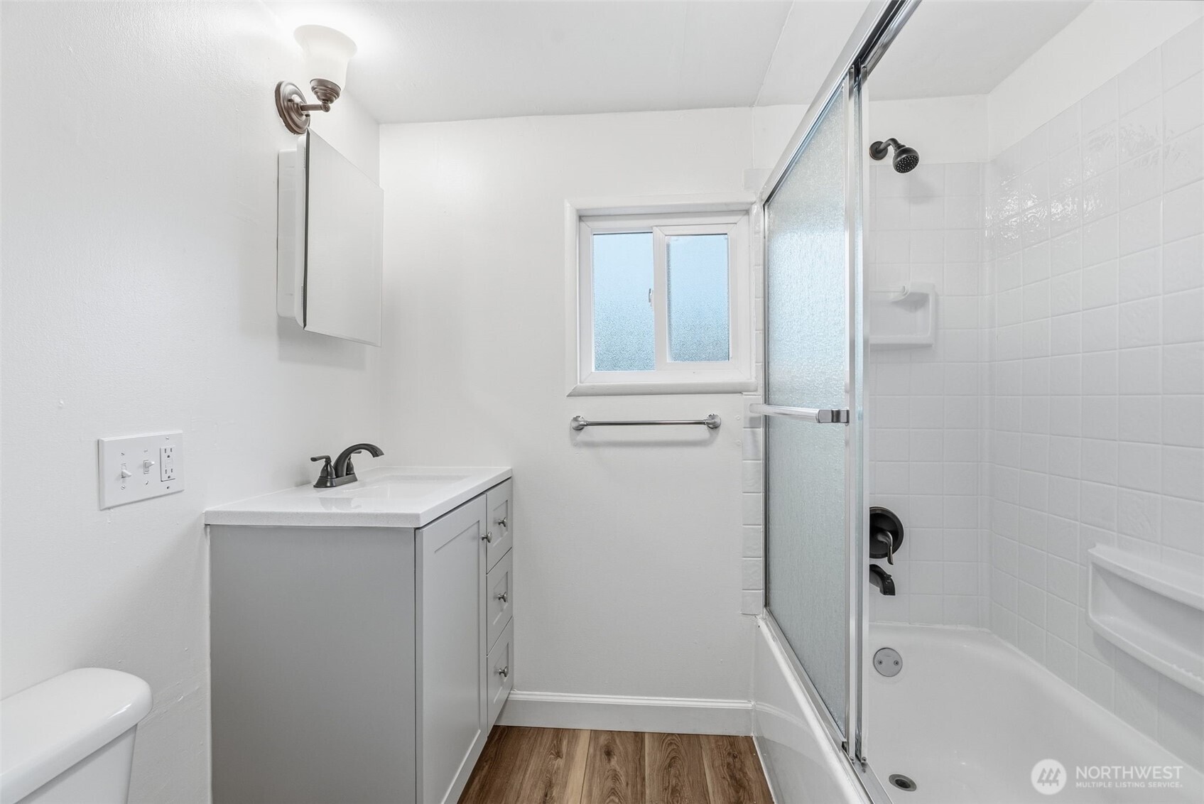 180 2nd Street Cathlamet, WA 98612 - Photo 17 of 40 a bathroom with a sink a toilet and shower