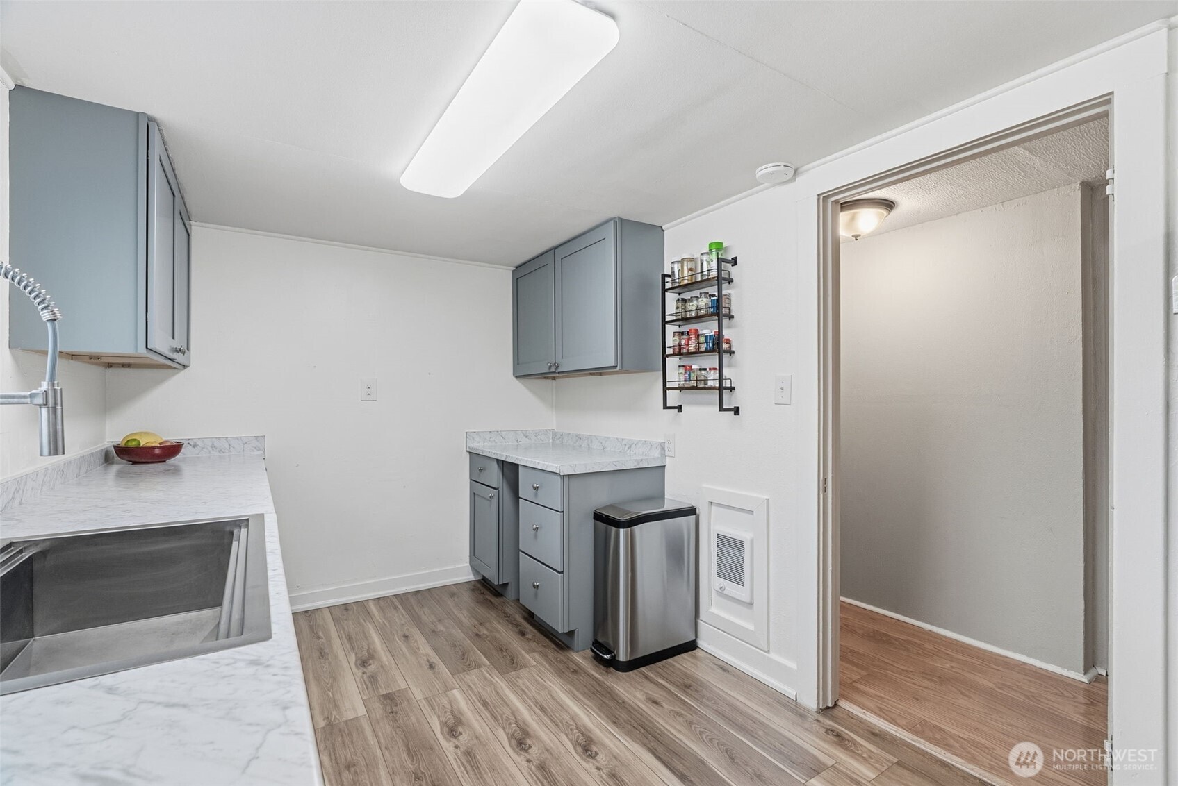 180 2nd Street Cathlamet, WA 98612 - Photo 23 of 40 a kitchen with granite countertop a stove and a refrigerator