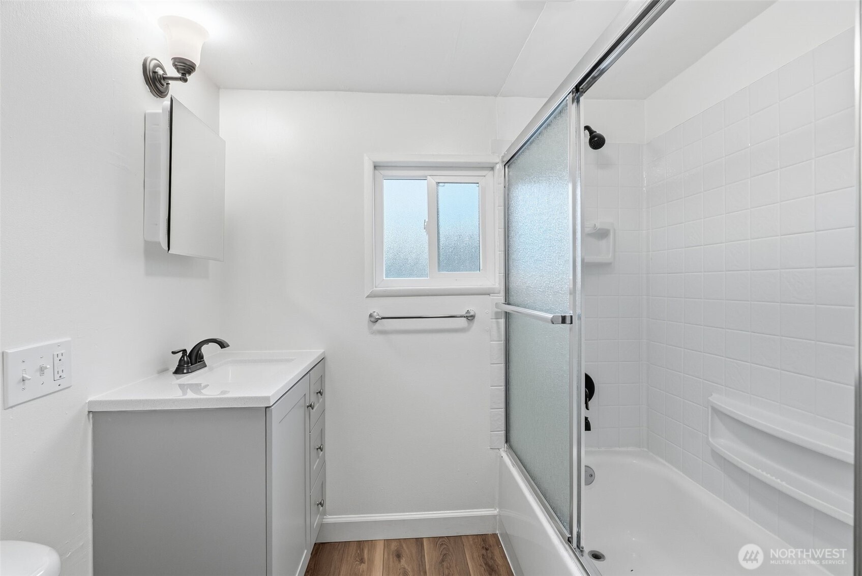 180 2nd Street Cathlamet, WA 98612 - Photo 24 of 40 a bathroom with a sink a toilet and shower