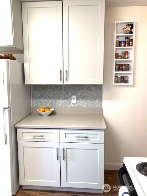 180 2nd Street Cathlamet, WA 98612 - Photo 30 of 40 a stove top oven sitting inside of a kitchen