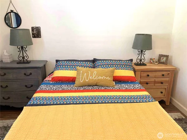 a room with furniture and a flat screen tv