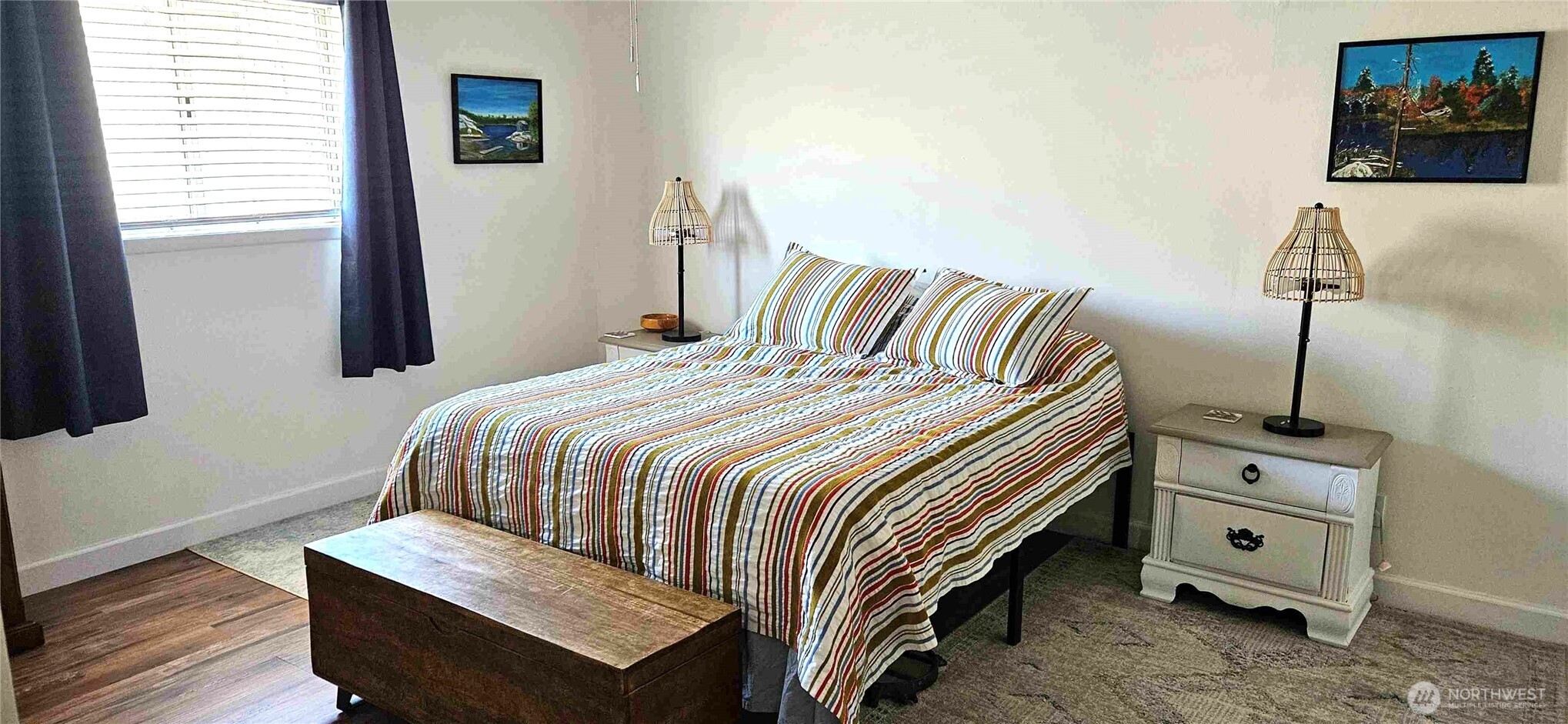 180 2nd Street Cathlamet, WA 98612 - Photo 37 of 40 a bedroom with a bed and a night stand