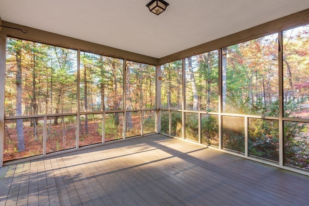 555 Heald Road Carlisle, MA 01741 - Photo 16 of 22 a view of empty room with wooden floor and city view