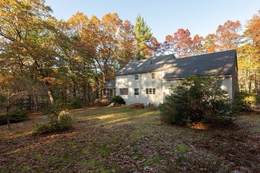 555 Heald Road Carlisle, MA 01741 - Photo 20 of 22 a view of a yard with plants and a trees