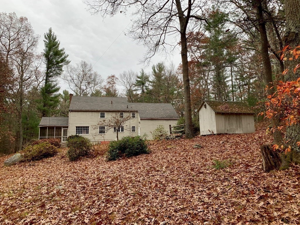 555 Heald Road Carlisle, MA 01741 - Photo 21 of 22 front view of a house with a dry yard