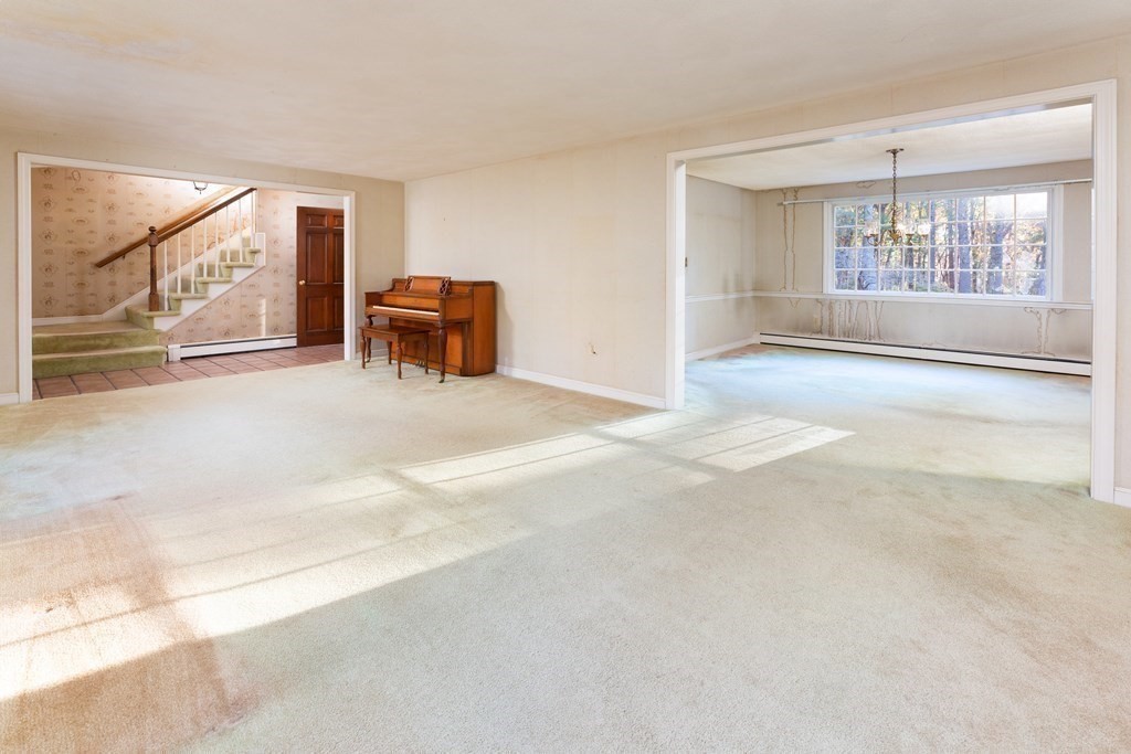 555 Heald Road Carlisle, MA 01741 - Photo 3 of 22 a living room with furniture and a large window