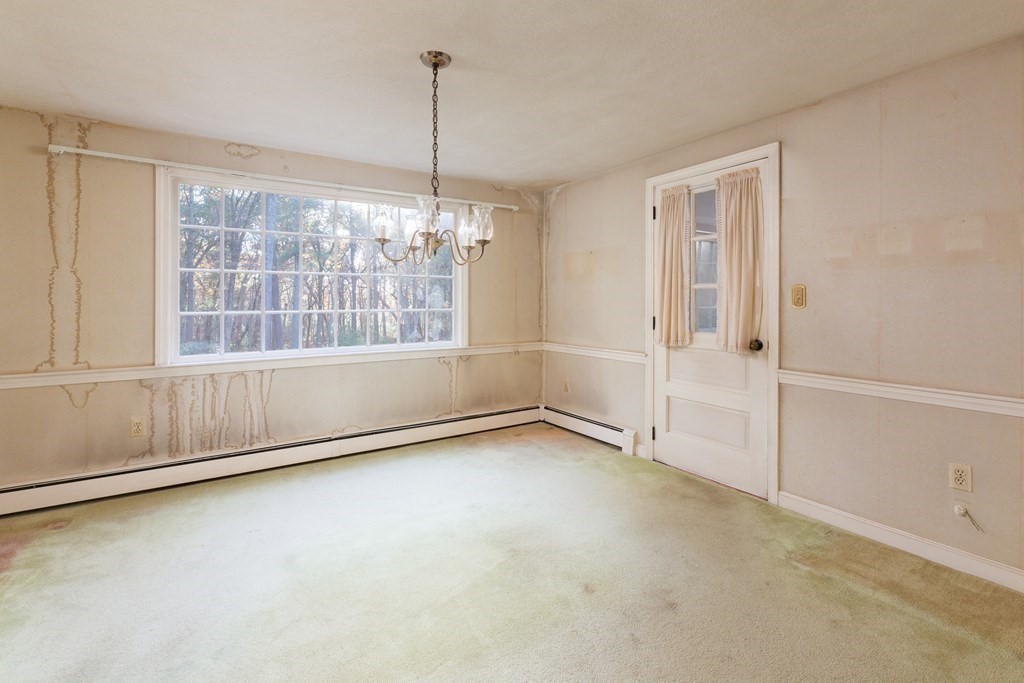 555 Heald Road Carlisle, MA 01741 - Photo 6 of 22 a view of an empty room with a window