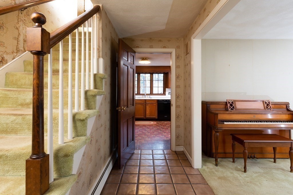 555 Heald Road Carlisle, MA 01741 - Photo 9 of 22 a view of a hallway with furniture and windows