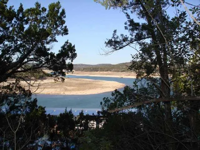 a view of an ocean and a mountain