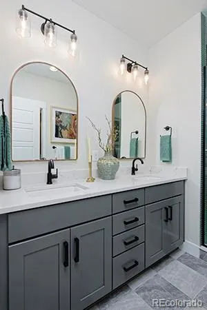 a bathroom with a double vanity sink and a mirror