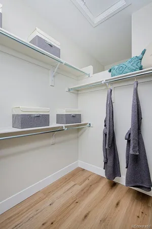 a view of a room with wooden floor