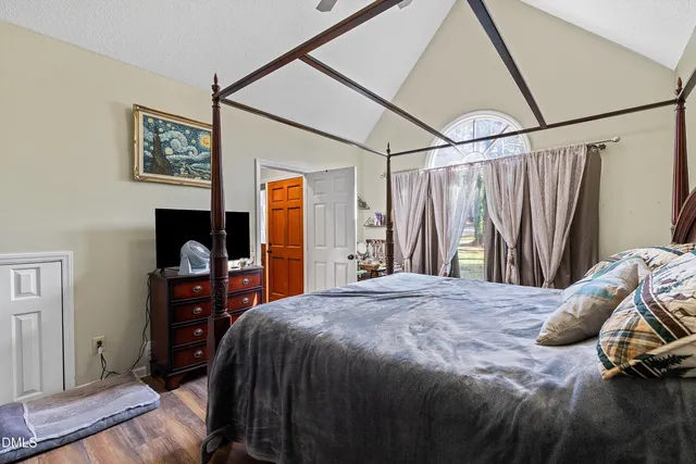 a bedroom with a bed and a dresser