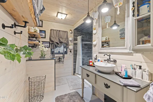 a kitchen with sink refrigerator and cabinets