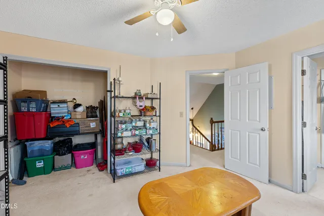 a bathroom with a granite countertop sink a mirror and a shower curtain