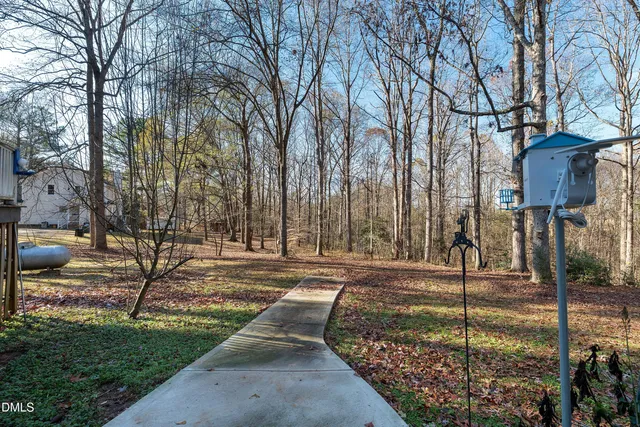 a view of a backyard of the house