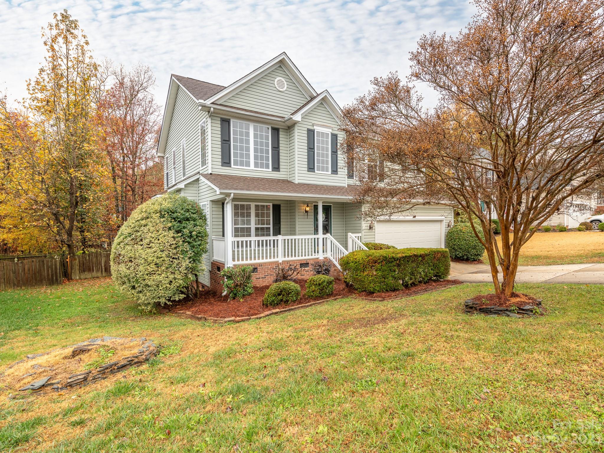 3764 Leela Palace Way Fort Mill, SC 29708 - Photo 2 of 32 a view of a house with a large tree and plants