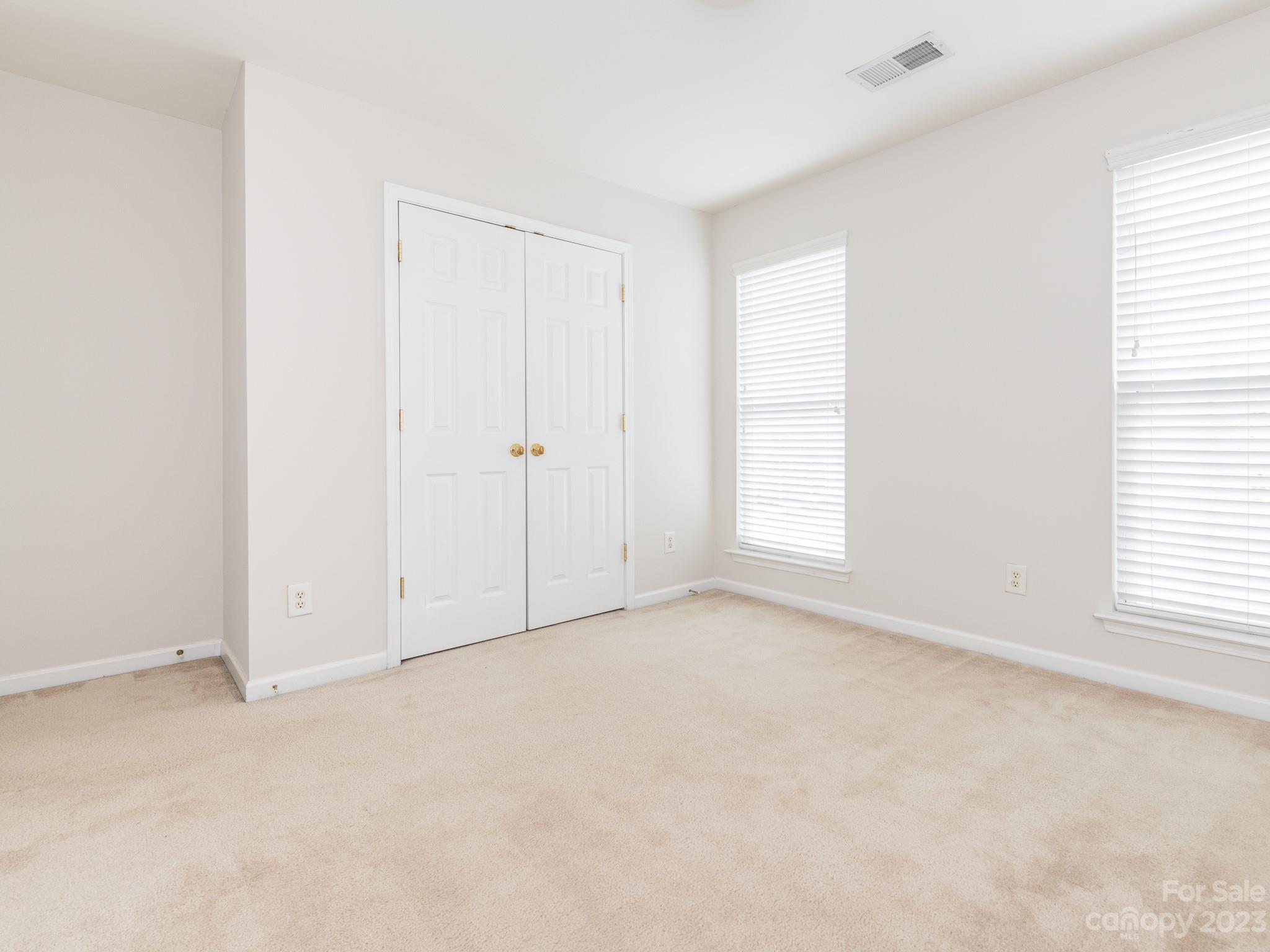 3764 Leela Palace Way Fort Mill, SC 29708 - Photo 25 of 32 an empty room with windows and closet