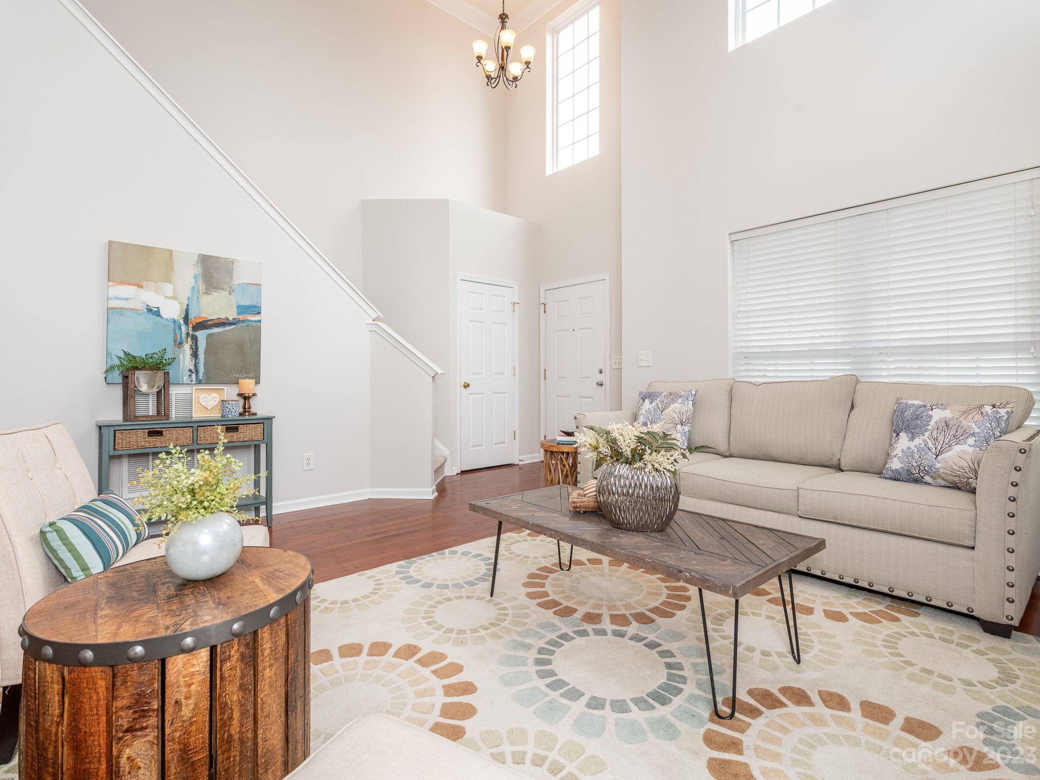 3764 Leela Palace Way Fort Mill, SC 29708 - Photo 7 of 32 a living room with furniture and wooden floor