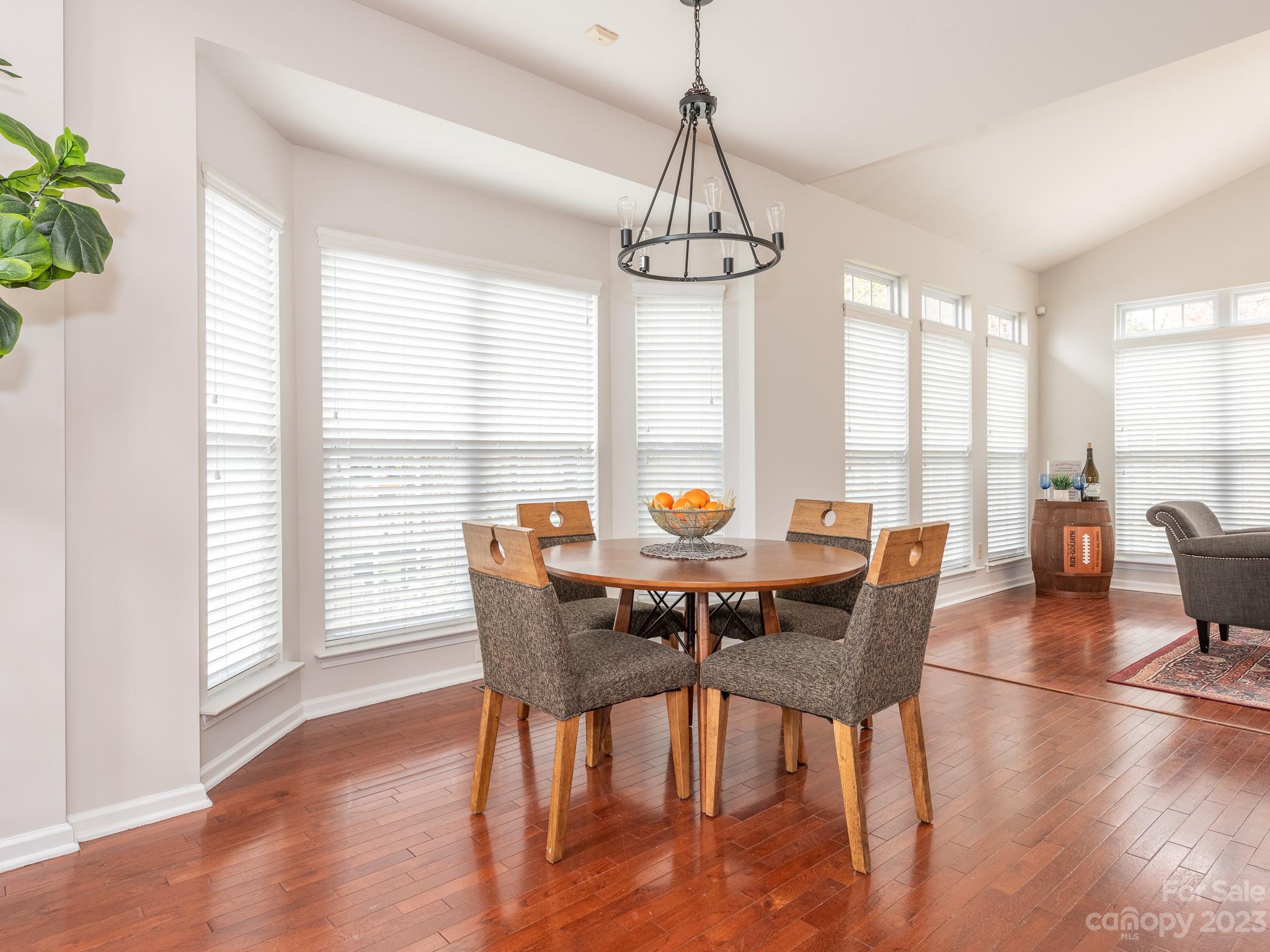 3764 Leela Palace Way Fort Mill, SC 29708 - Photo 8 of 32 a view of a dining room with furniture window and wooden floor