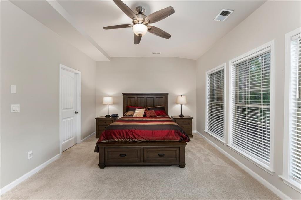 113 Tyson Woods Road Acworth, GA 30102 - Photo 21 of 37 a spacious bedroom with a bed and window