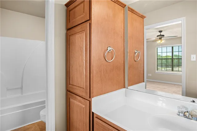 a bathroom with a tub and a shower