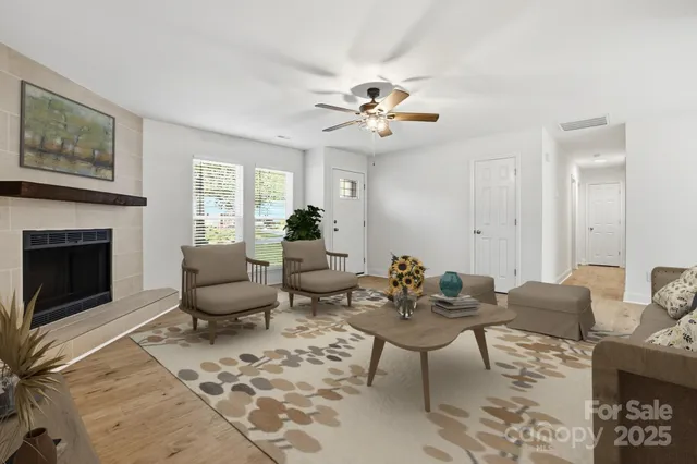a living room with furniture and a fireplace