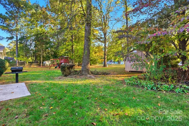 a backyard of a house with lots of green space