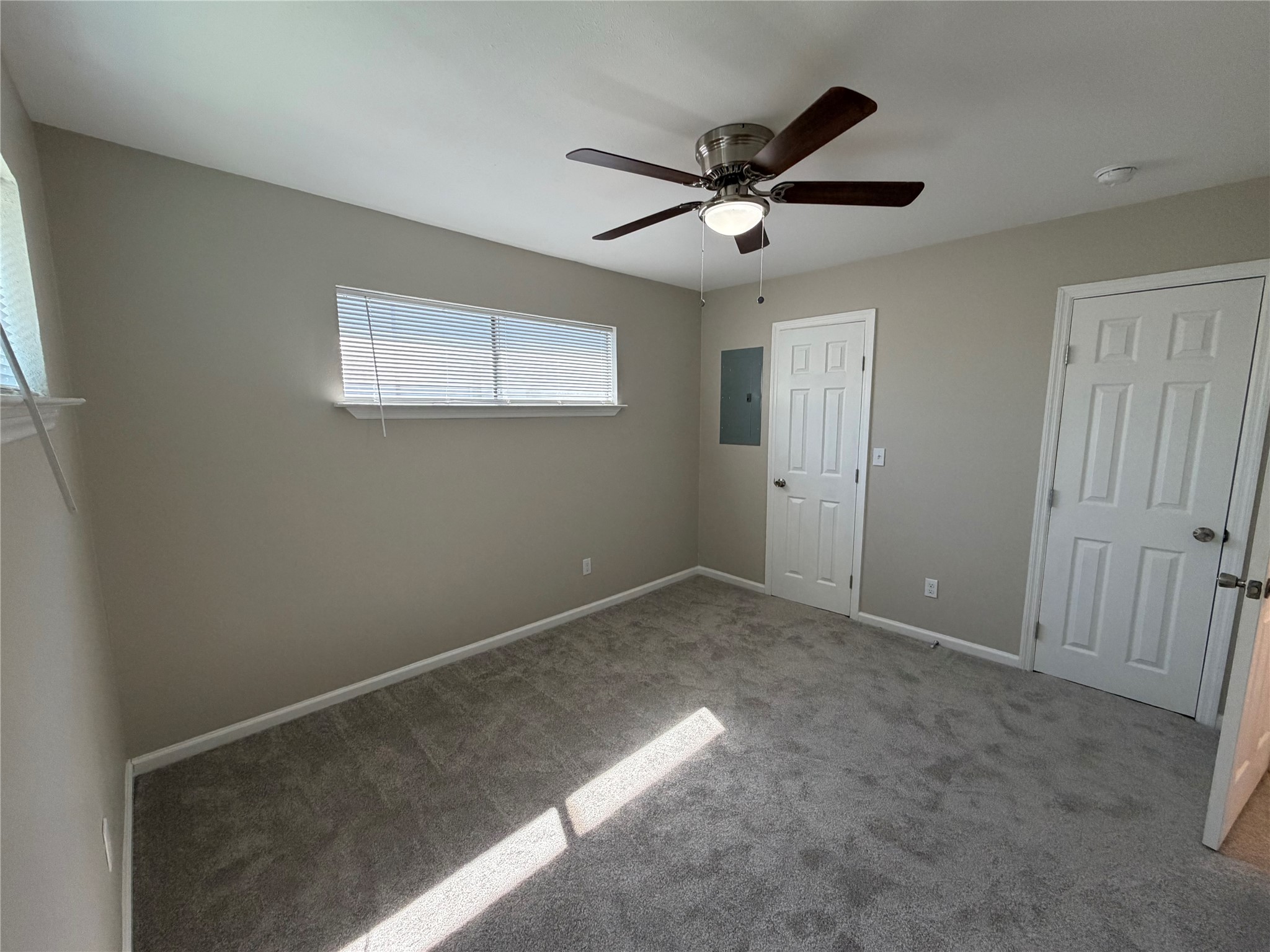 3113 Arbor Street, Unit 4 Houston, TX 77004 - Photo 5 of 11 a view of a big room with wooden floor closet and windows