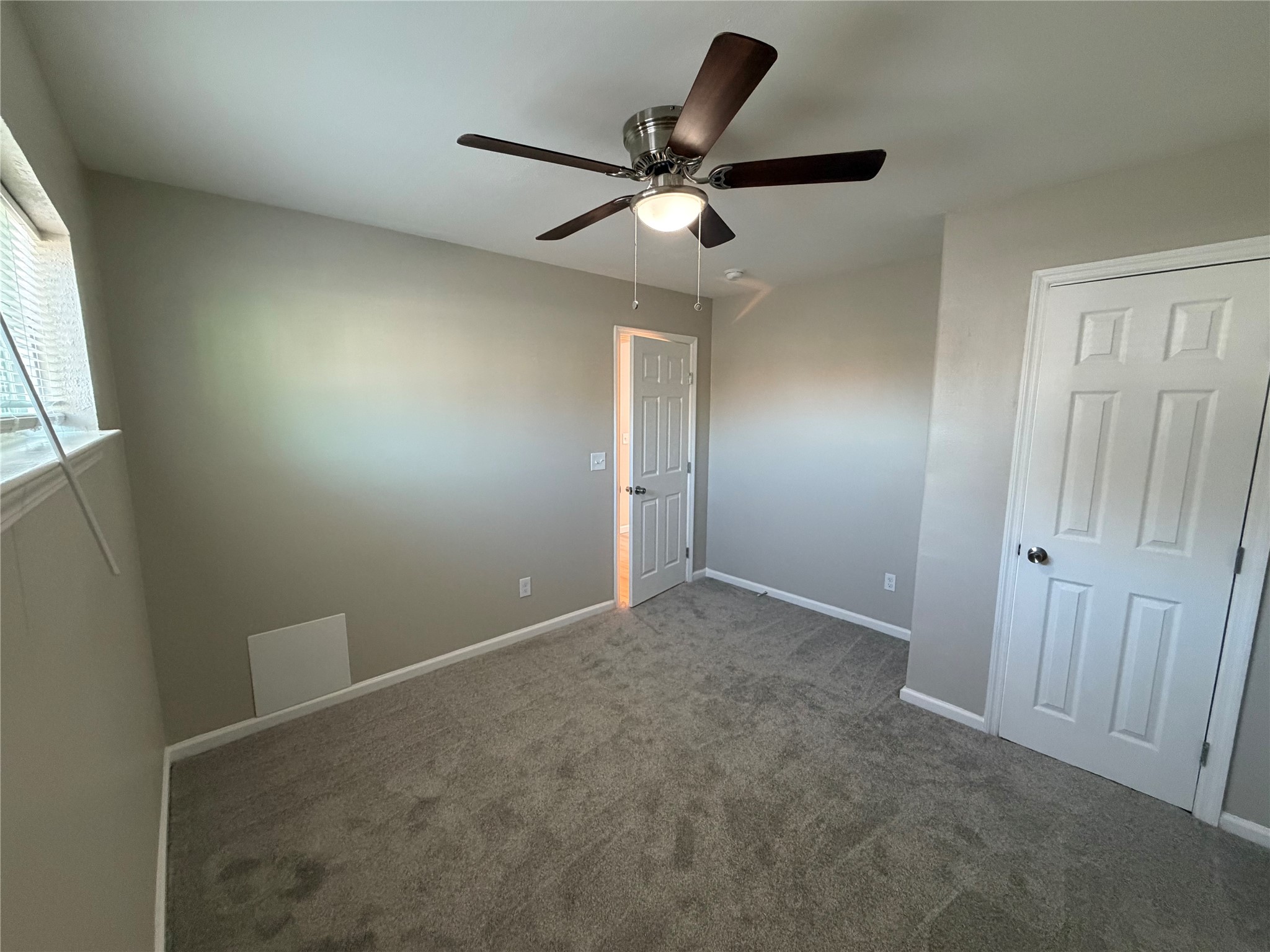 3113 Arbor Street, Unit 4 Houston, TX 77004 - Photo 7 of 11 an empty room with closet and windows