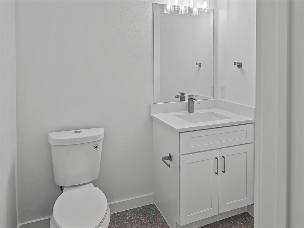 9565 Thorncrown Lane Fort Worth, TX 76179 - Photo 14 of 25 a bathroom with a toilet sink and mirror