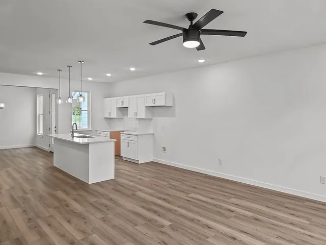 a view of kitchen with wooden floor and window