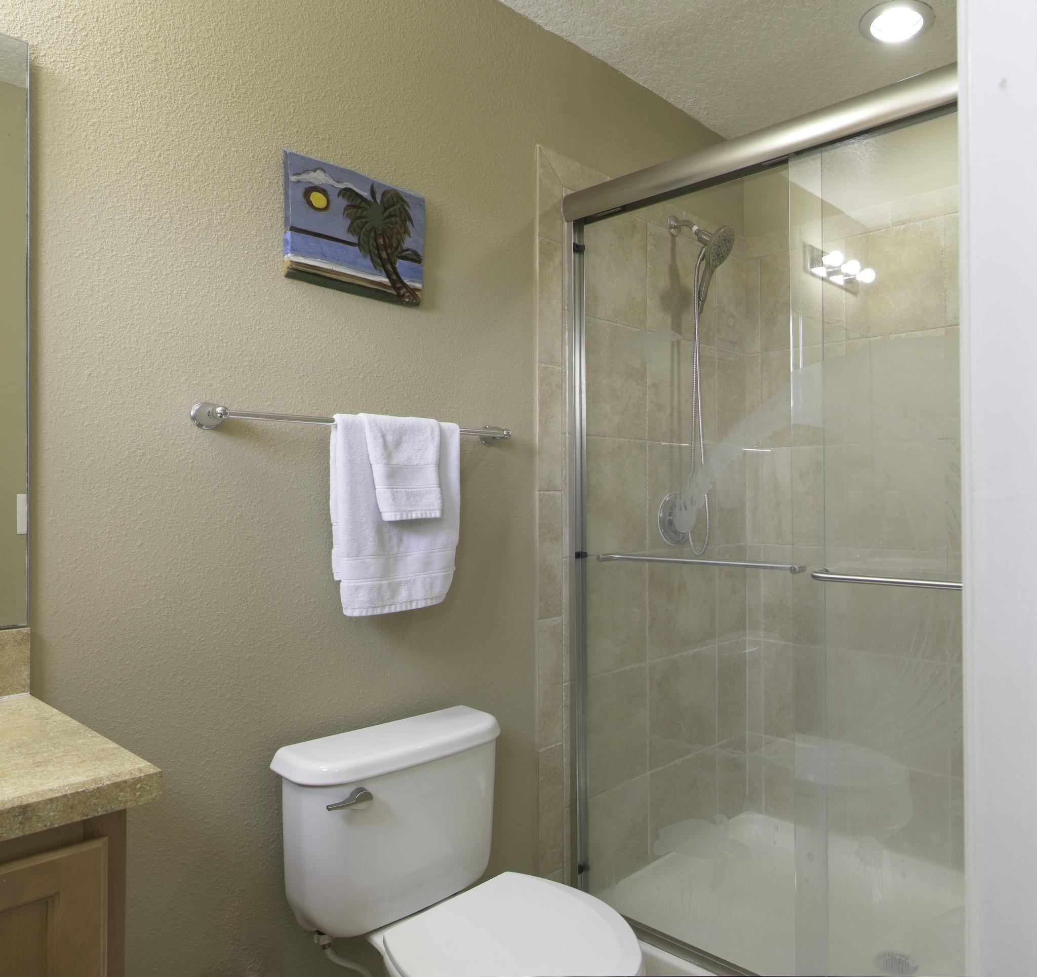 167 Islander Drive St. Augustine, FL 32080 - Photo 15 of 34 a white toilet sitting next to a bath tub shower