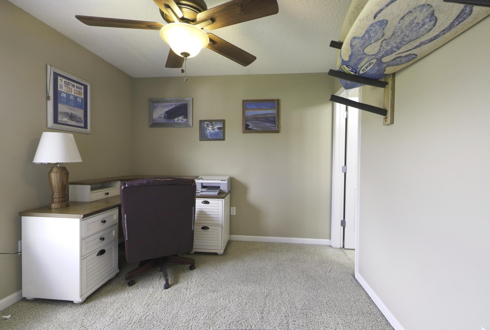 167 Islander Drive St. Augustine, FL 32080 - Photo 17 of 34 a view of a workspace with furniture and a window