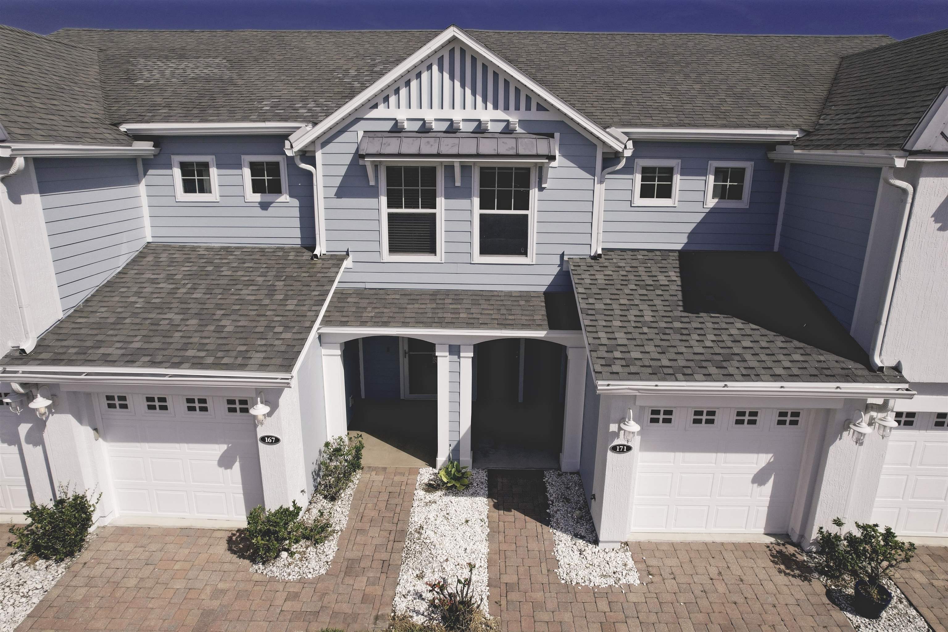 167 Islander Drive St. Augustine, FL 32080 - Photo 2 of 34 a front view of a house with a yard