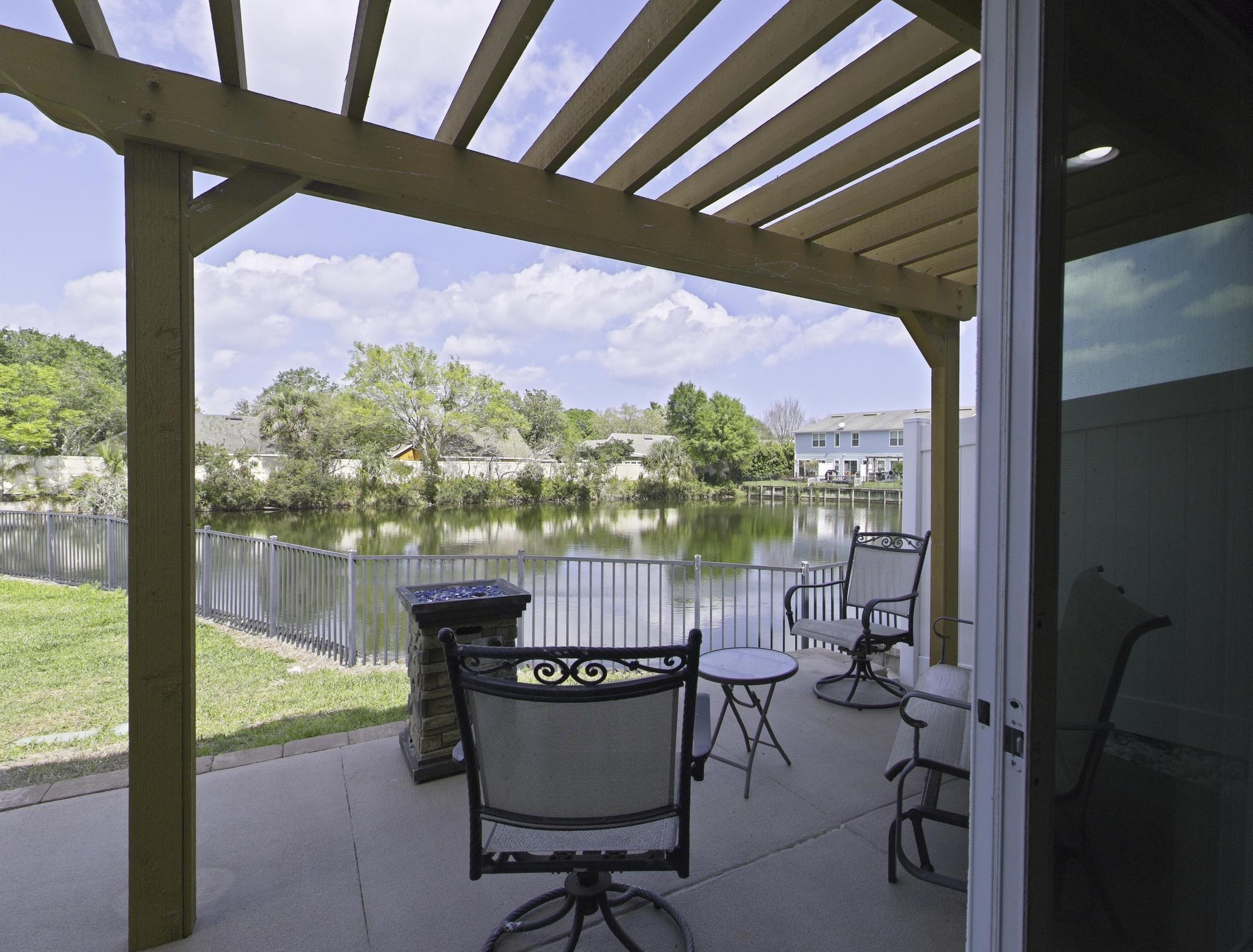 167 Islander Drive St. Augustine, FL 32080 - Photo 23 of 34 a view of a porch with furniture and a yard