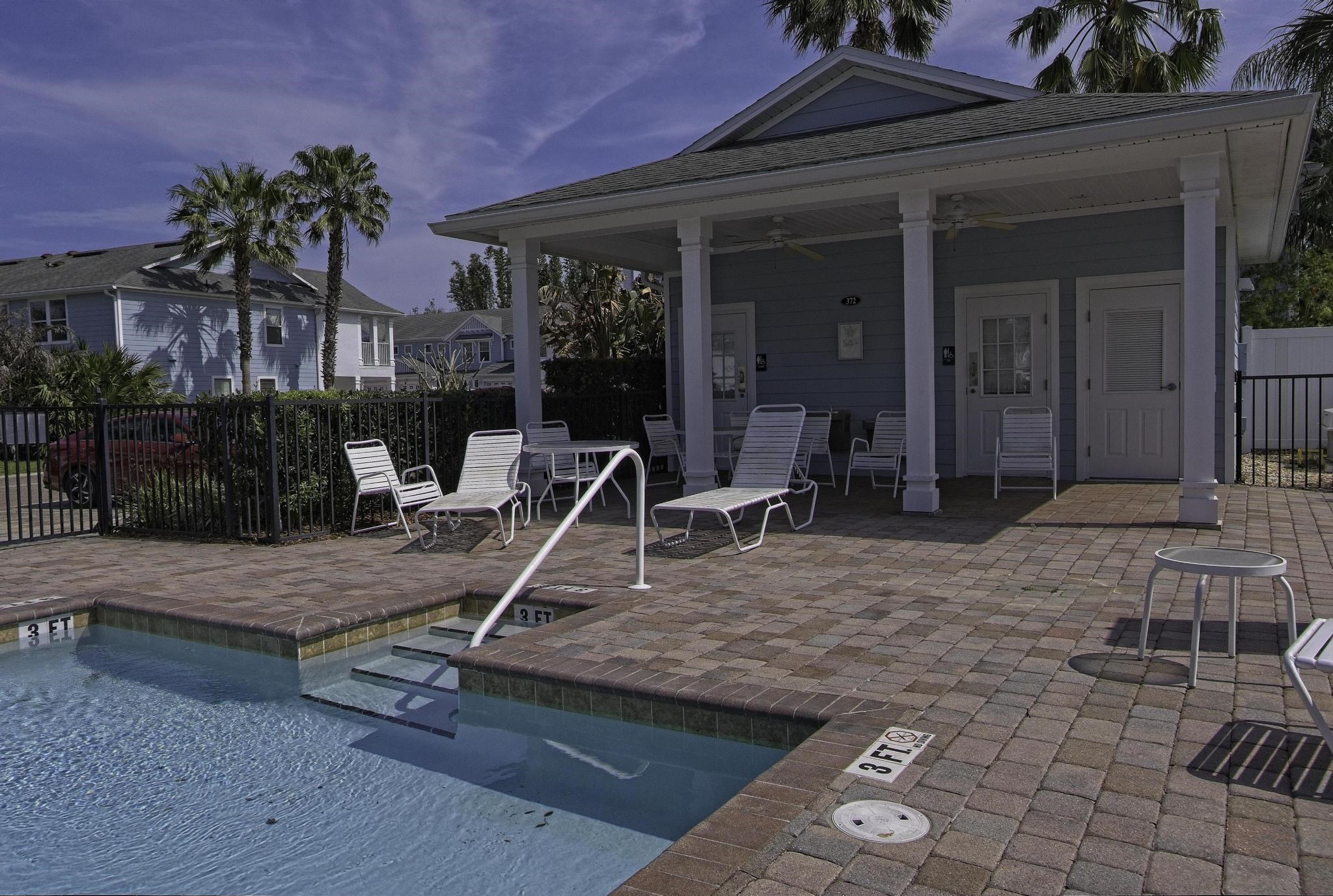 167 Islander Drive St. Augustine, FL 32080 - Photo 29 of 34 a view of a house with backyard porch and sitting area