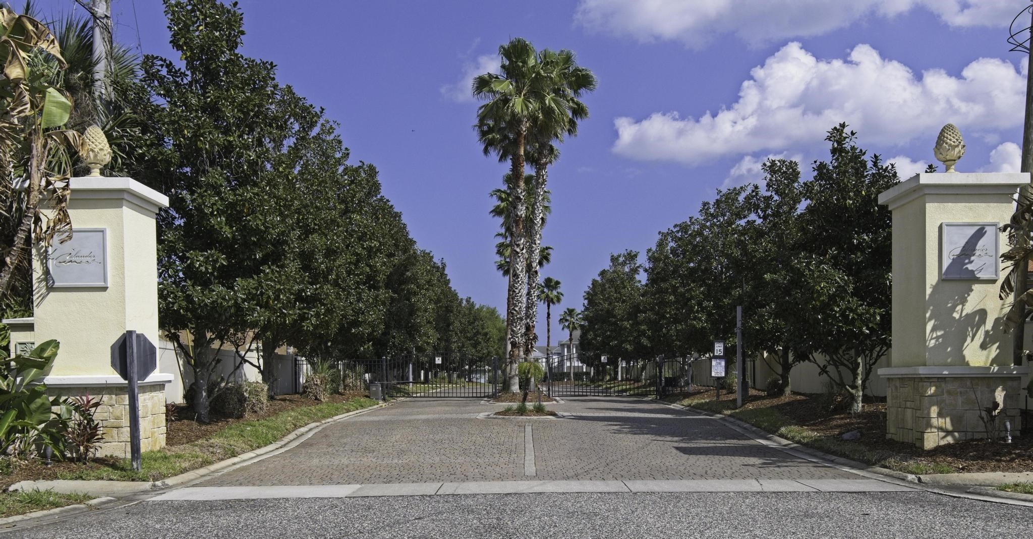 167 Islander Drive St. Augustine, FL 32080 - Photo 34 of 34 a street sign on a sidewalk next to a road