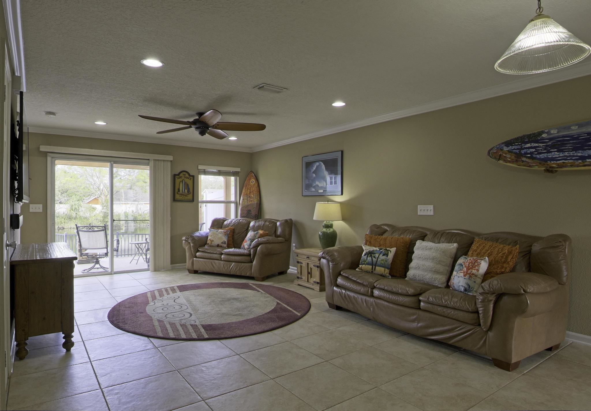 167 Islander Drive St. Augustine, FL 32080 - Photo 6 of 34 a living room with furniture and a large window