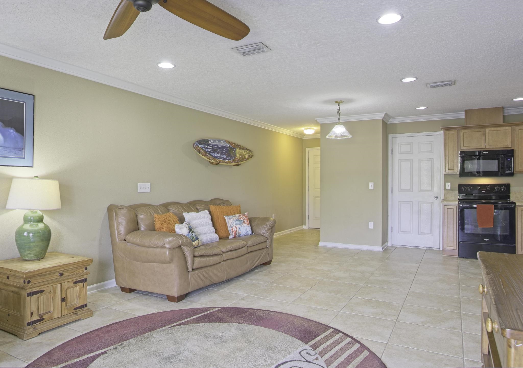 167 Islander Drive St. Augustine, FL 32080 - Photo 8 of 34 a living room with furniture and a flat screen tv