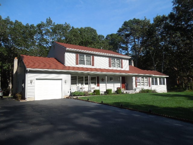 309 Butter Road Palermo, NJ 08230 - Photo 1 of 1 a front view of a house with a garden and trees