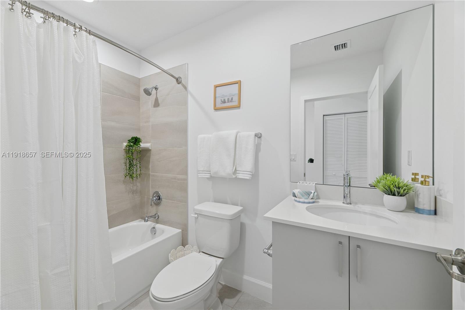 355 Northwest 30th Avenue, Unit 1311 Pompano Beach, FL 33069 - Photo 15 of 19 a bathroom with a sink toilet and shower
