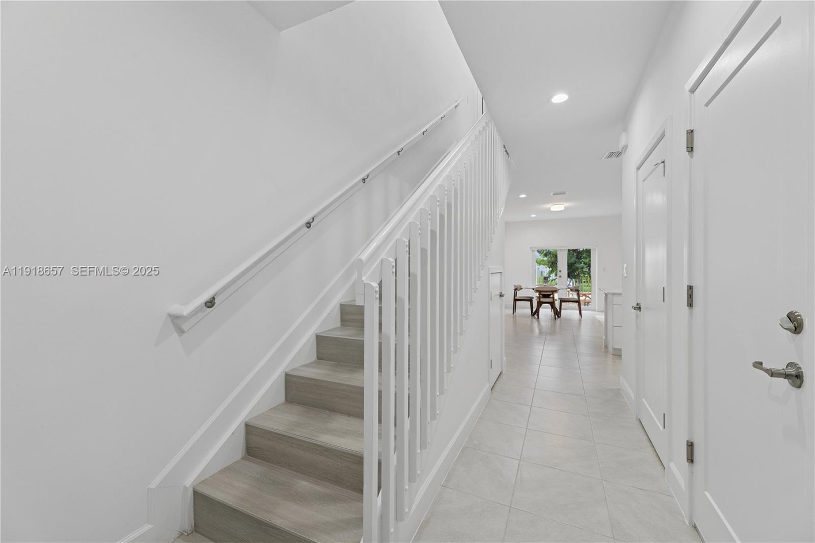 355 Northwest 30th Avenue, Unit 1311 Pompano Beach, FL 33069 - Photo 10 of 19 a view of entryway and hall with wooden floor