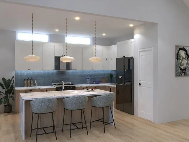 a kitchen with a table and chairs in it