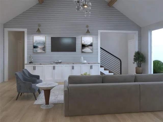 a living room with furniture and a potted plant