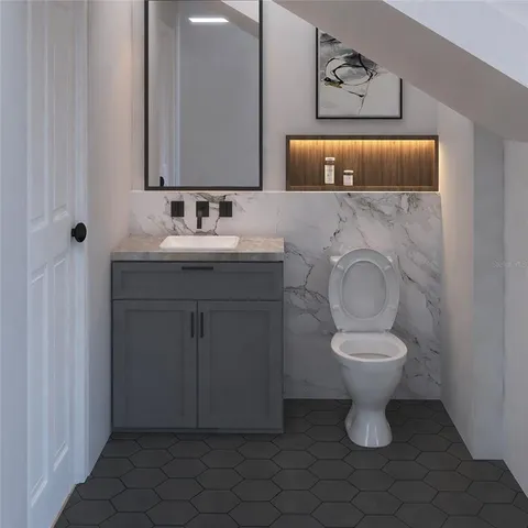 a bathroom with a toilet sink vanity and mirror