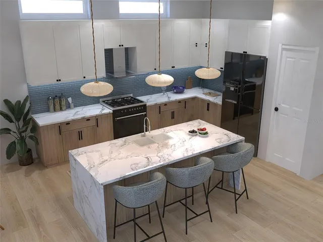a kitchen with a table and chairs in it