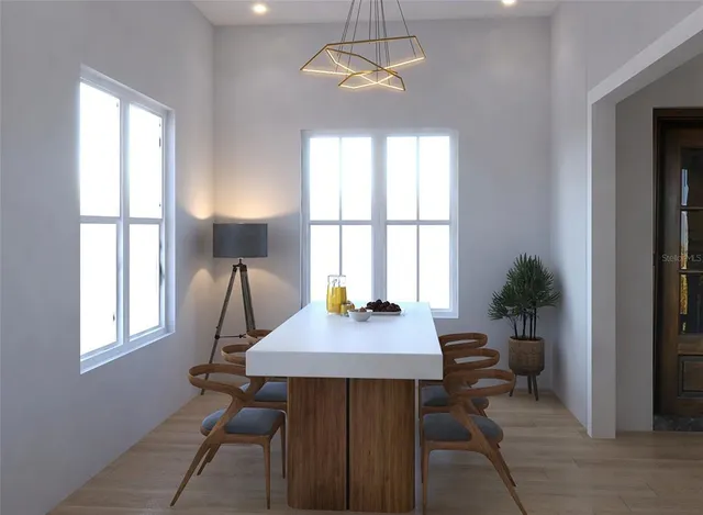 a view of a dining room with furniture window and outside view
